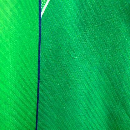 Green vintage football shirt with dark blue trim and textured diagonal pattern, classic retro soccer jersey style. - Eire Ireland 1994/1995/1996 Home Football Shirt Umbro