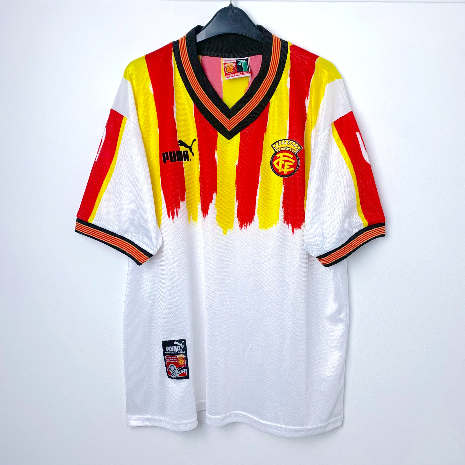Classic Catalunya football shirt by Puma in white with red and yellow stripes on a white background