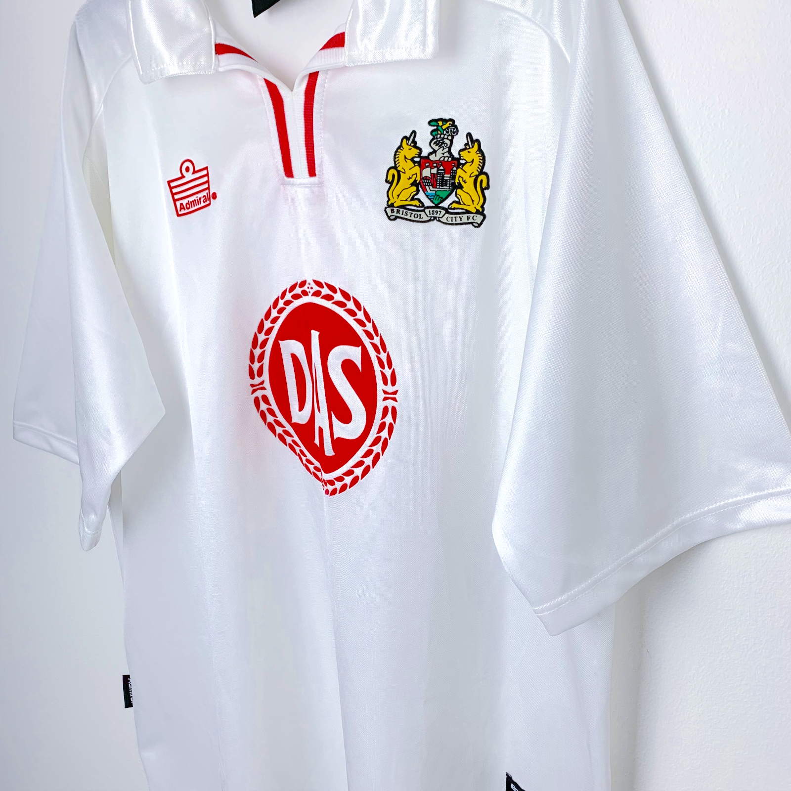 Side angle view of Bristol City away retro football shirt by Admiral in white. DAS red sponsor.