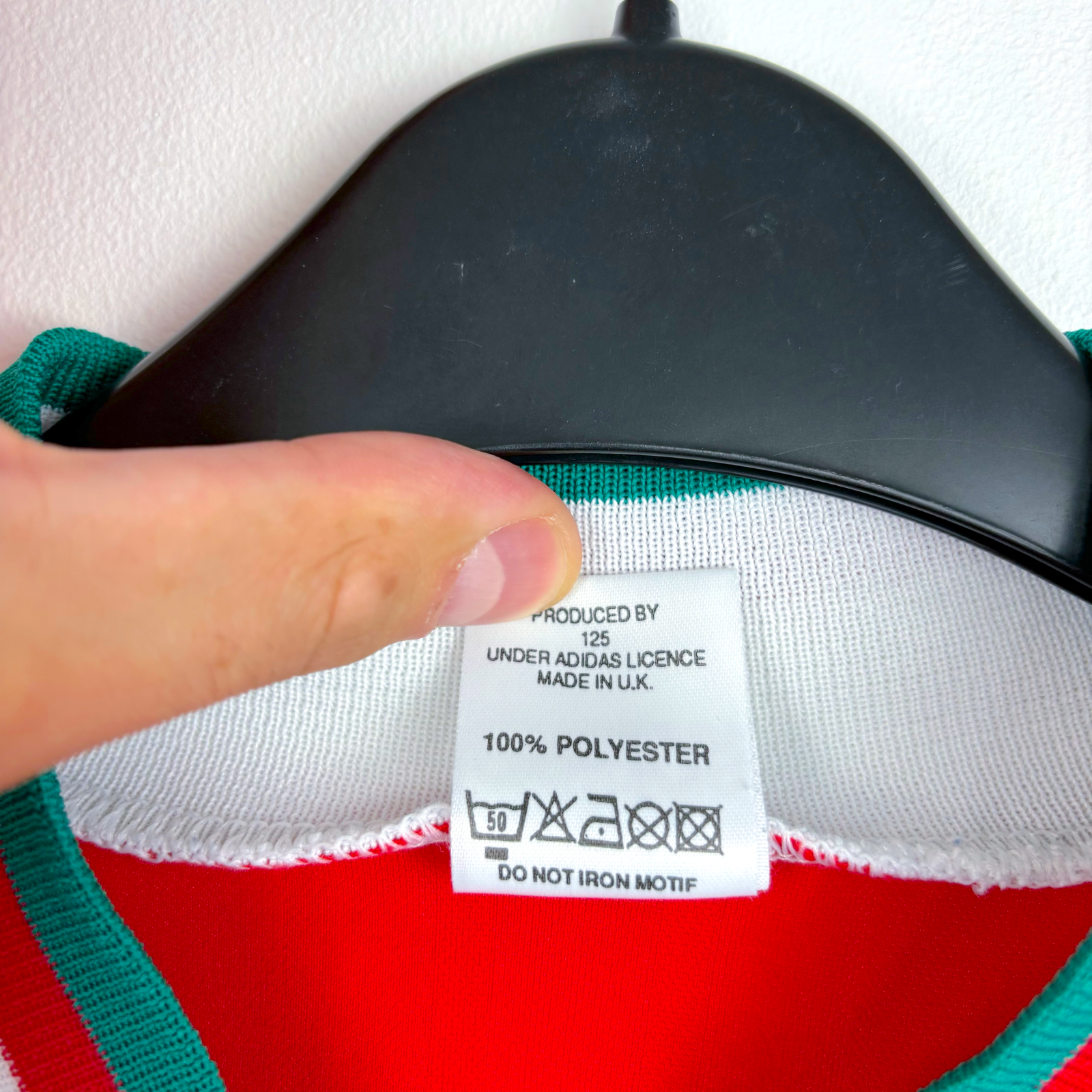 White Adidas tag on vintage Liverpool FC football shirt with care instructions and 100% polyester label. - Liverpool FC 1993/1994/1995 Home Football Shirt Adidas