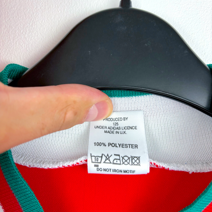 White Adidas tag on vintage Liverpool FC football shirt with care instructions and 100% polyester label. - Liverpool FC 1993/1994/1995 Home Football Shirt Adidas