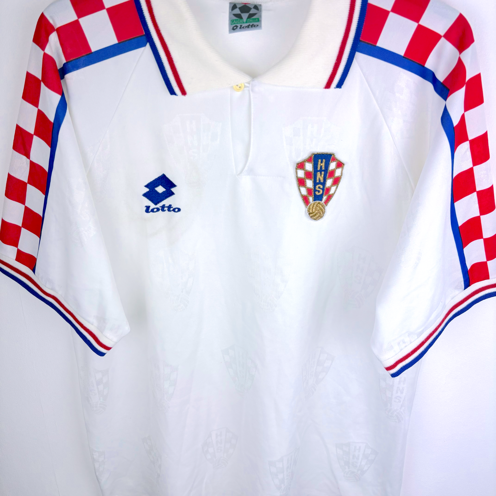 White vintage football shirt with red and white checkered sleeves, blue Lotto logo, and Croatian crest on chest. - Croatia 1996/1997/1998 Lotto Away Football Shirt
