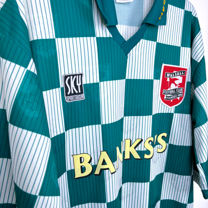 Side view of Walsall old football shirt made by Sky Leisure. Check green and off-white pattern with Banks's yellow sponsor.