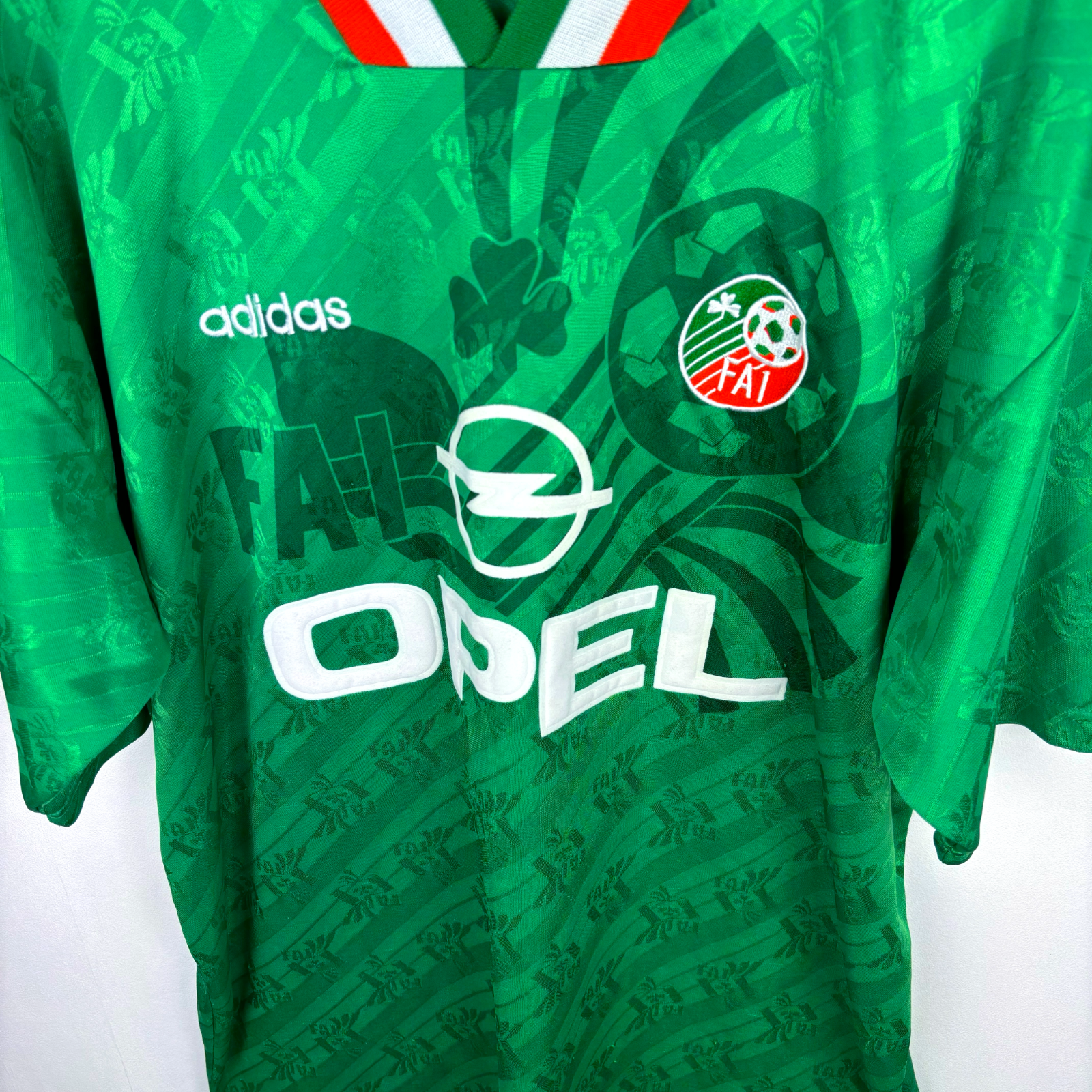 Green vintage football shirt with Adidas logo, FAI crest, Opel sponsor, and Ireland flag collar trim, classic retro soccer. - Eire Ireland 1994-1995 USA World Cup Home Football Shirt Adidas