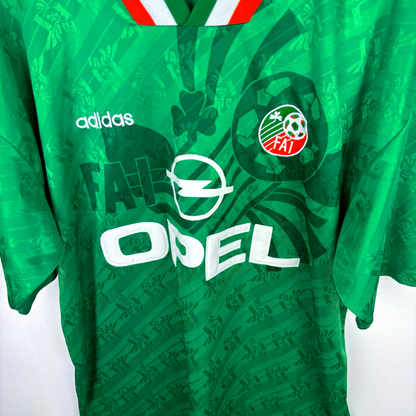 Green vintage football shirt with Adidas logo, FAI crest, Opel sponsor, and Ireland flag collar trim, classic retro soccer. - Eire Ireland 1994-1995 USA World Cup Home Football Shirt Adidas