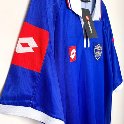 Side view of blue 2002 Yugoslavia shirt by Lotto with red and white accents 
