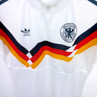 White vintage football shirt with Germany badge, Adidas logo, and retro tricolor chevron stripes. - Germany 1988/1989/1990/1991/1992 Adidas Home Football Shirt