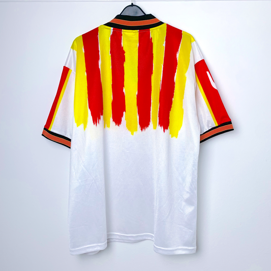Rear view of Catalunya retro football shirt by Puma in white with red and yellow stripes on a white background
