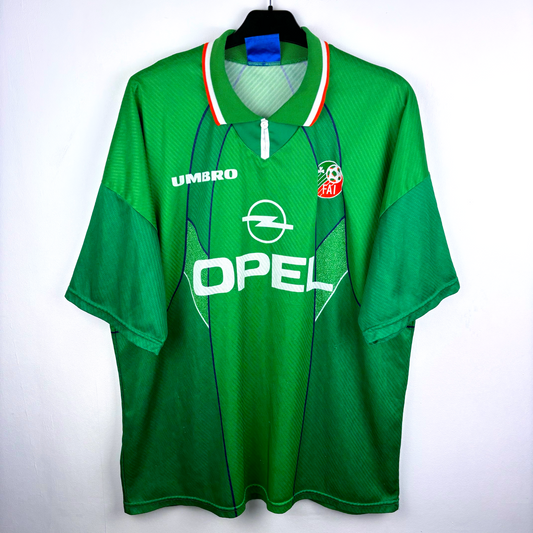 Green vintage football shirt with white and orange collar, Umbro logo, Opel sponsor, and Ireland crest, retro soccer jersey. - Eire Ireland 1994/1995/1996 Home Football Shirt Umbro