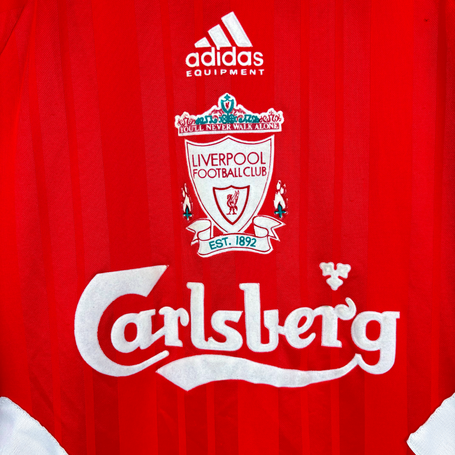 Red vintage football shirt with Liverpool FC crest, Adidas logo, and white Carlsberg sponsor logo. - Liverpool FC 1993/1994/1995 Home Football Shirt Adidas