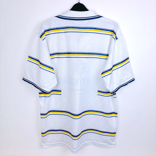 Rear view of retro shirt of Parma AC produced by Lotto. White body featuring blue and yellow hoops.