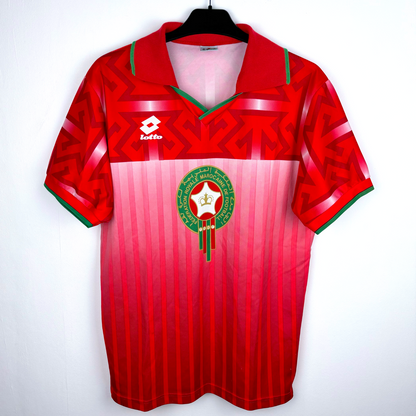 Morocco 1994 vintage football shirt in red with geometric patterns, green trim, and Lotto logo retro soccer jersey. - Morocco 1994/1995/1996 Home Football Shirt Maglia Calcio Lotto
