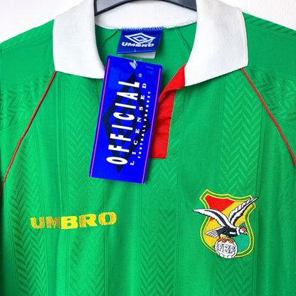 Close up of classic 1994 Bolivia home shirt with Umbro logo and tag, featuring country's bird emblem