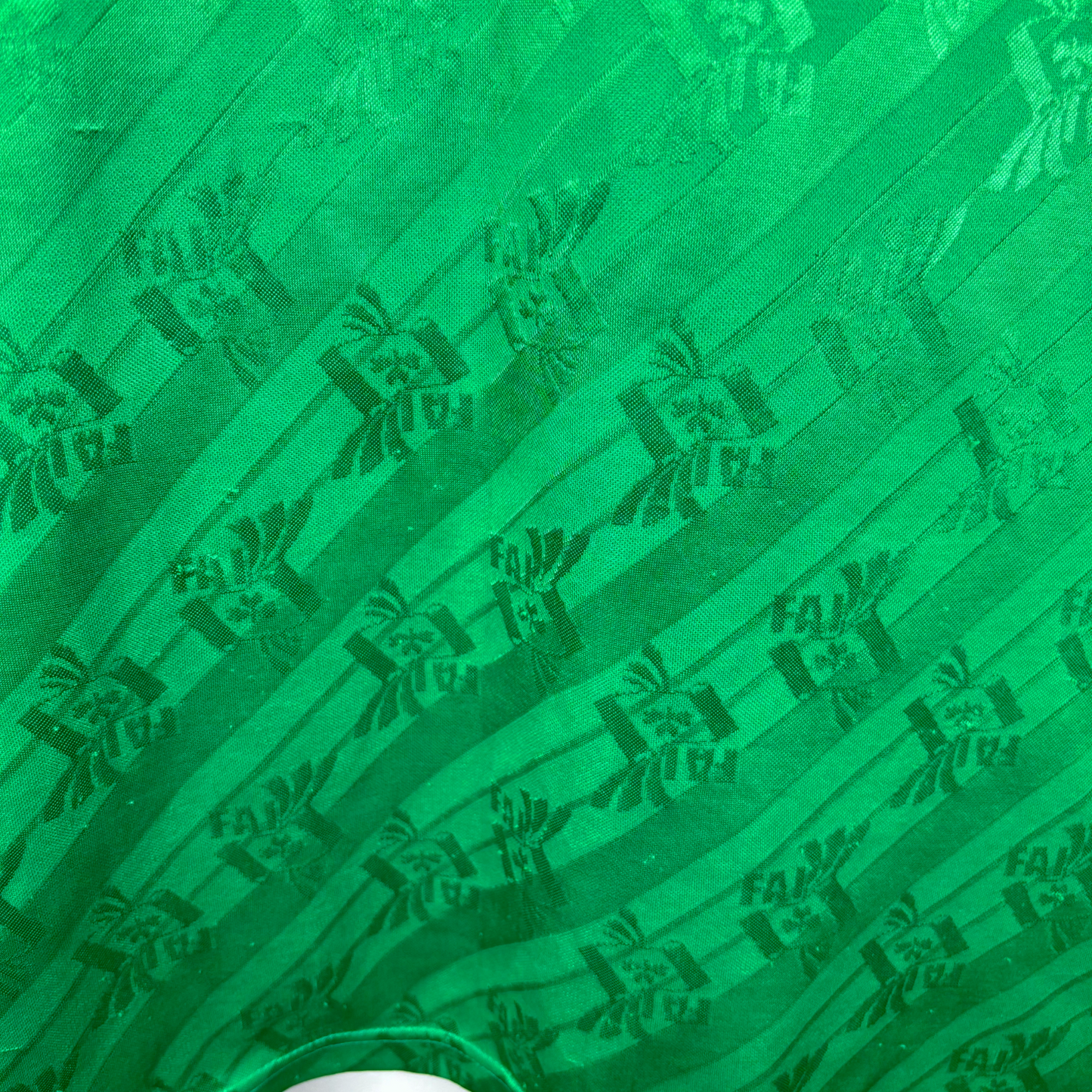 Green vintage football shirt featuring diagonal stripes and Adidas logo pattern, retro soccer jersey style. - Eire Ireland 1994-1995 USA World Cup Home Football Shirt Adidas