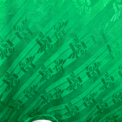 Green vintage football shirt featuring diagonal stripes and Adidas logo pattern, retro soccer jersey style. - Eire Ireland 1994-1995 USA World Cup Home Football Shirt Adidas
