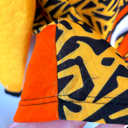 Liverpool FC 1995-1996 vintage football shirt sleeve detail with yellow quilted fabric and black geometric pattern on orange . - Liverpool FC 1995-1996 Goal Keeper Football Shirt Adidas
