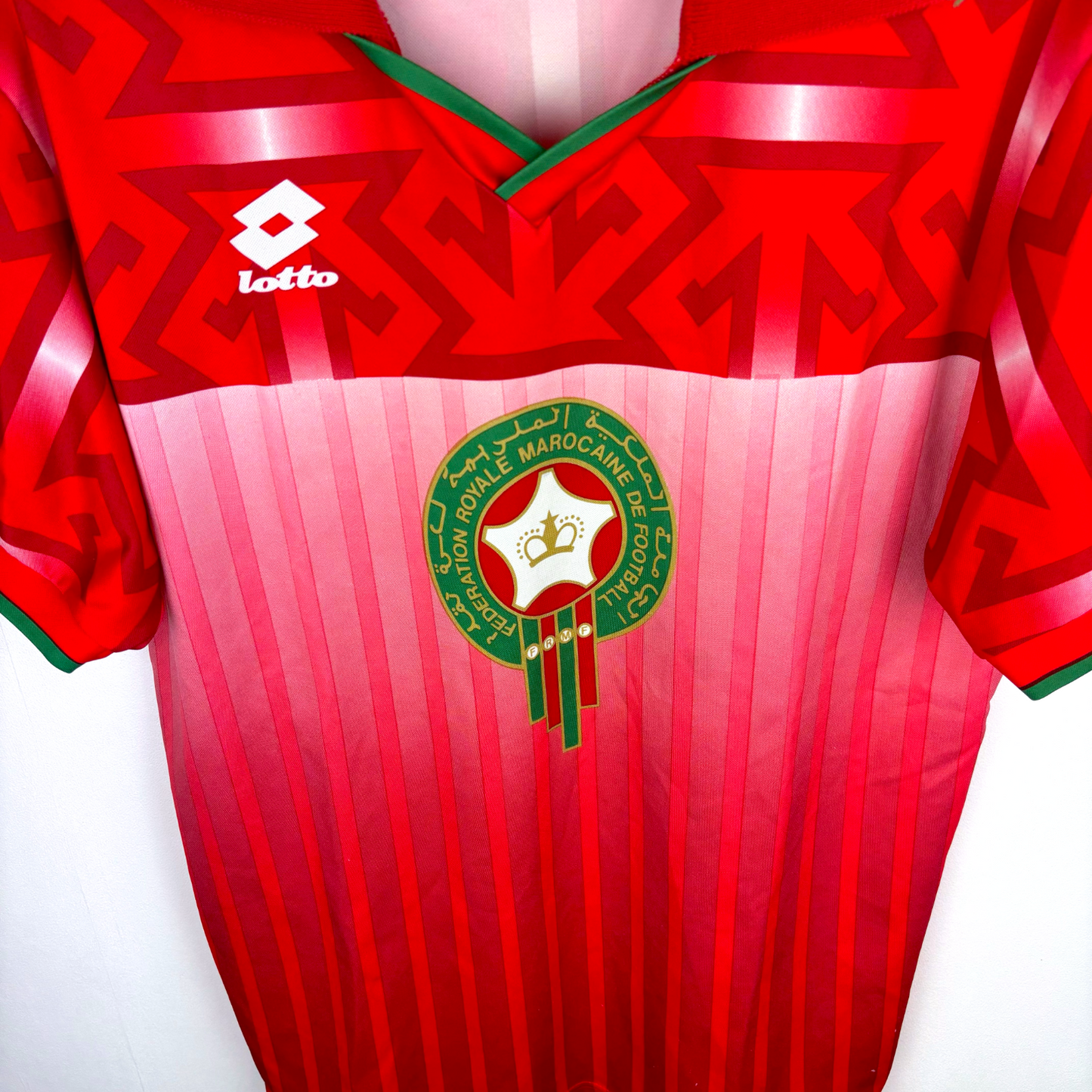 Morocco 1994 vintage football shirt in red with geometric patterns and Lotto logo, retro soccer jersey design. - Morocco 1994/1995/1996 Home Football Shirt Maglia Calcio Lotto