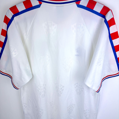 White vintage Croatia football shirt with subtle checkered pattern, red and blue striped shoulder accents, and blue trim on. - Croatia 1996/1997/1998 Lotto Away Football Shirt