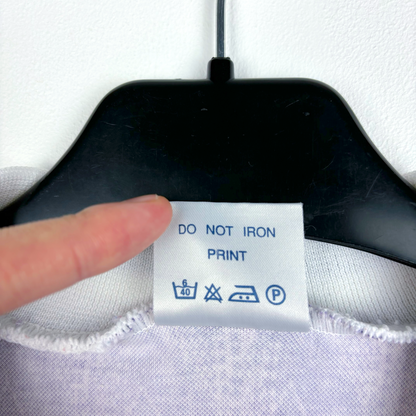 Care label on vintage retro football shirt showing washing and ironing instructions. - Clydebank FC Wet Wet Wet 1993/1994/1995 Away Football Shirt Matchwinner