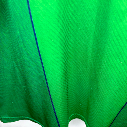 Green vintage football shirt with subtle vertical stripes and thin blue piping detail, classic retro soccer jersey style. - Eire Ireland 1994/1995/1996 Home Football Shirt Umbro