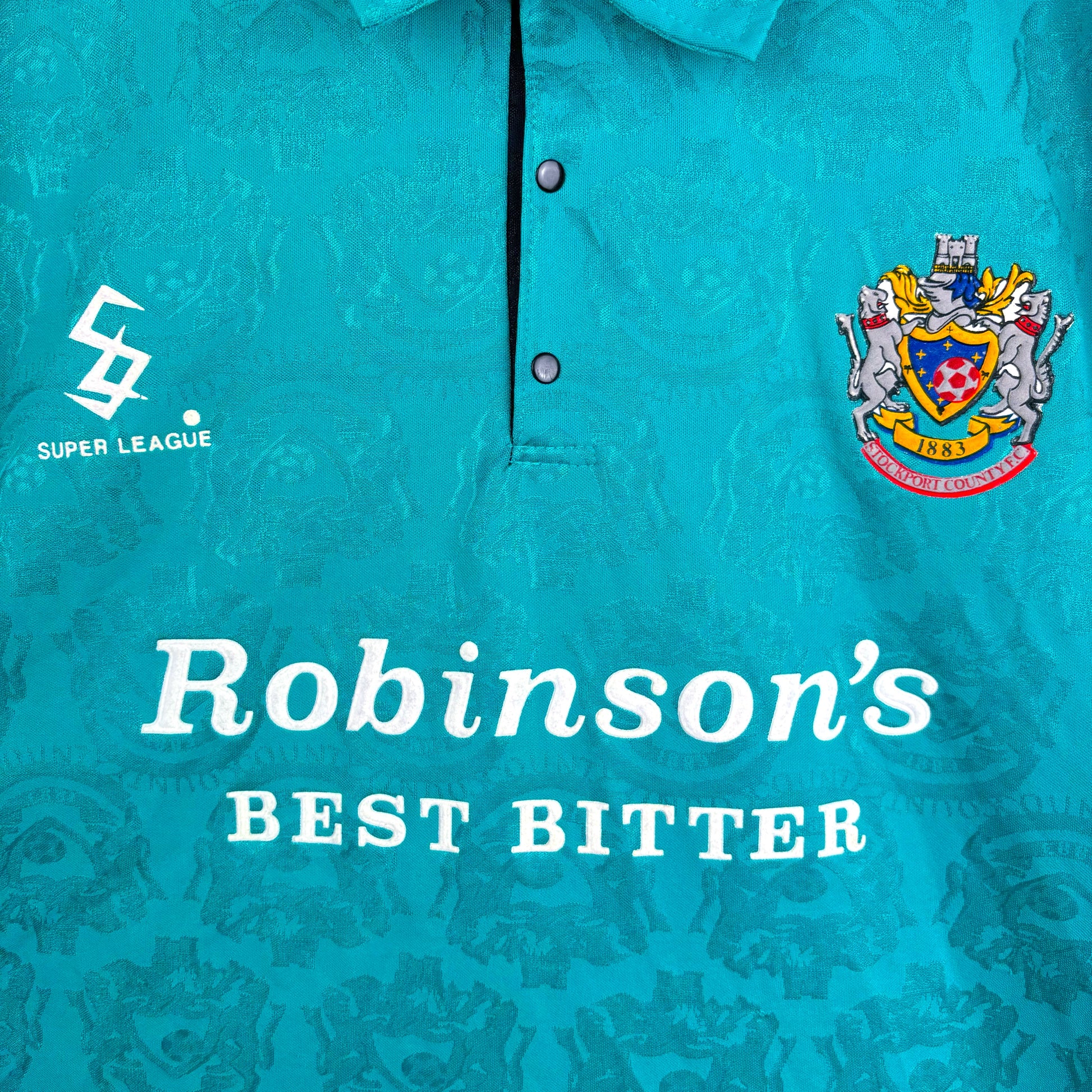 Close-up of Stockport County 1993-1995 Away Shirt sponsor and badges – vintage Super League football shirt
