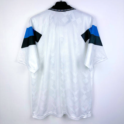 Rear view of Aston Villa 1990-1993 away classic football shirt made by Umbro. Sublimated jacquard pattern ion white body. Black and blue trim with black Mita Copiers sponsor.