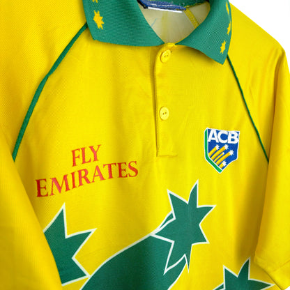 Classic Australia 1999 World Cup cricket shirt by Asics, close-up side view of Fly Emirates sponsor logo and yellow and green fabric details