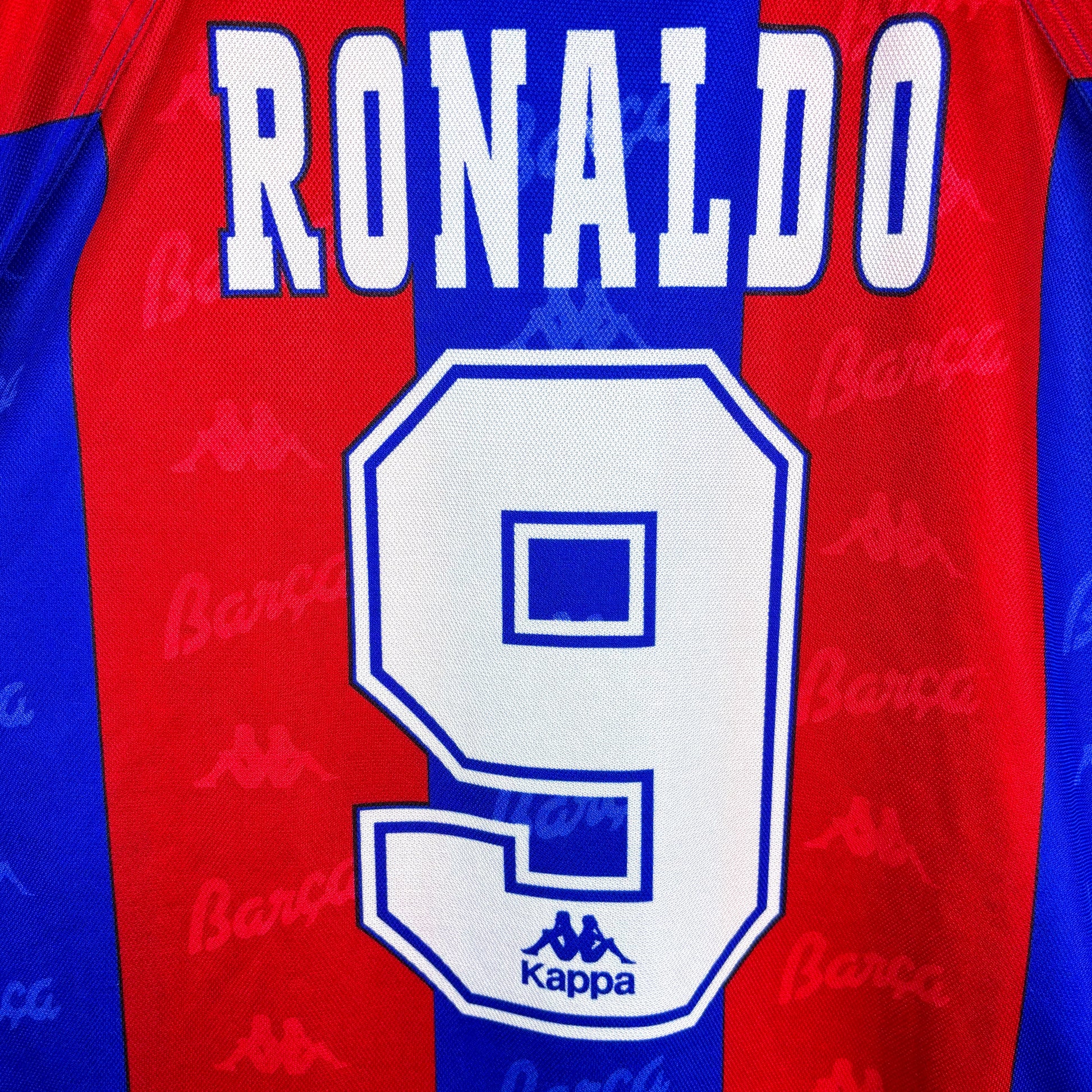Close-up of Barcelona 1995-1997 Kappa home vintage football shirt. Red and blue stripes with sublimated Ronaldo 9 nameset.