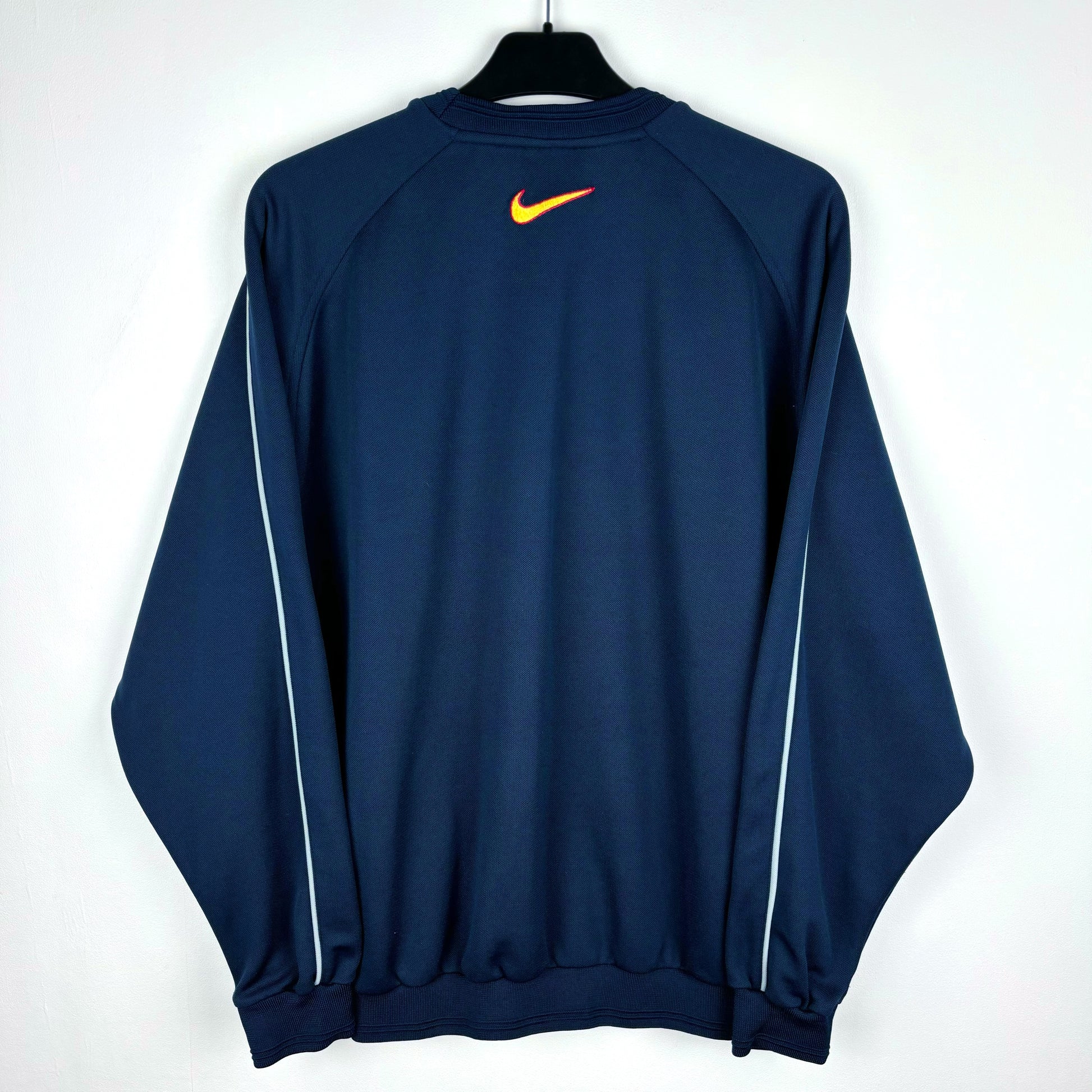Rear view of Barcelona 2000-2001 retro Nike training sweatshirt. Navy body with central Nike swoosh below neck. White sleeve piping.
