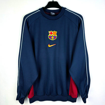 Barcelona 2000-2001 vintage Nike training sweatshirt. Navy body with central  Nike swoosh and club badge. Red side panels.