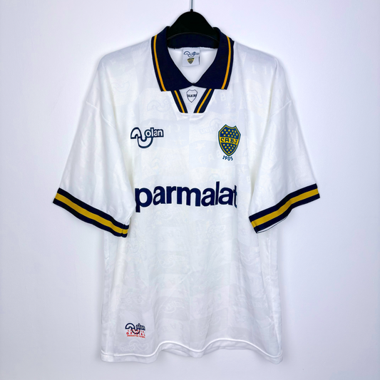 Boca Juniors 1995-1996 away classic football shirt produced by OLAN. White body featuring navy and gold accents. 