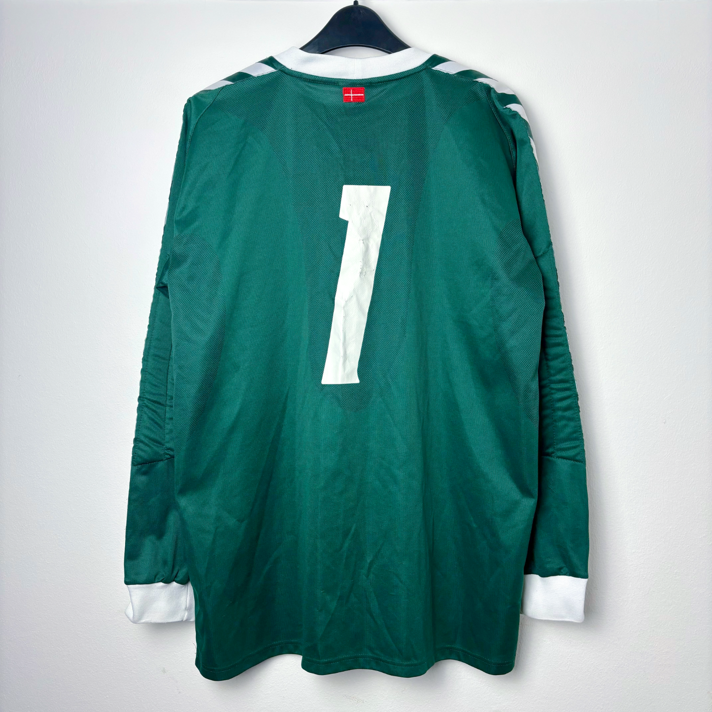 Rear view of Denmark 2002 goalkeeper/third classic soccer jersey made by Hummel. Forest green body coupled with tapered sleeves donning the classic Hummel chevrons. White number 1 print to the back