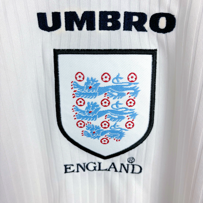 Close up of badge on classic England 1998-1999 home football shirt by Umbro.