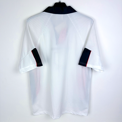 Rear view of England 1997-1999 home football shirt by Umbro. White body with navy trim.