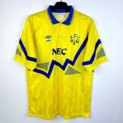 Everton 1990-1992 away retro football shirt made by Umbro. Blue sublimated zig-zag across yellow body . NEC sponsor.