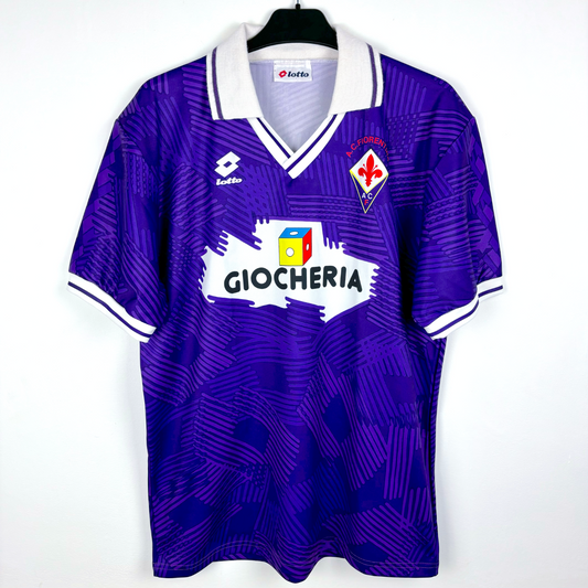 Fiorentina 1991-1992 classic home football shirt produced by Lotto. Purple body spanned by Lotto logo pattern and white collar.