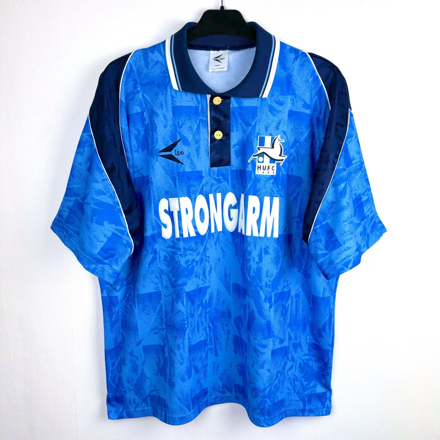 Hartlepool United 1993-1995 vintage football shirt with 'Strongarm' sponsor. Blue body with navy trim and collar.