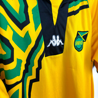 Side view of Jamaica 1998-1999 Kappa home retro soccer jersey. Yellow body with black and green trim.