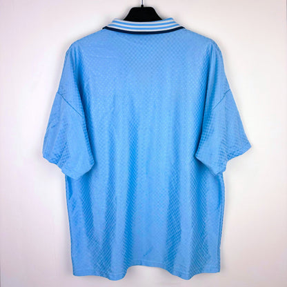 Rear view of Man City 1995-1997 Umbro home classic football shirt. Sky blue body with sublimated checkered pattern.