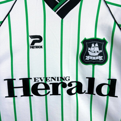 Plymouth Argyle 2000-2001 Admiral vintage football shirt white body and green pinstripes. Close up of Evening Herald sponsor and club badge..