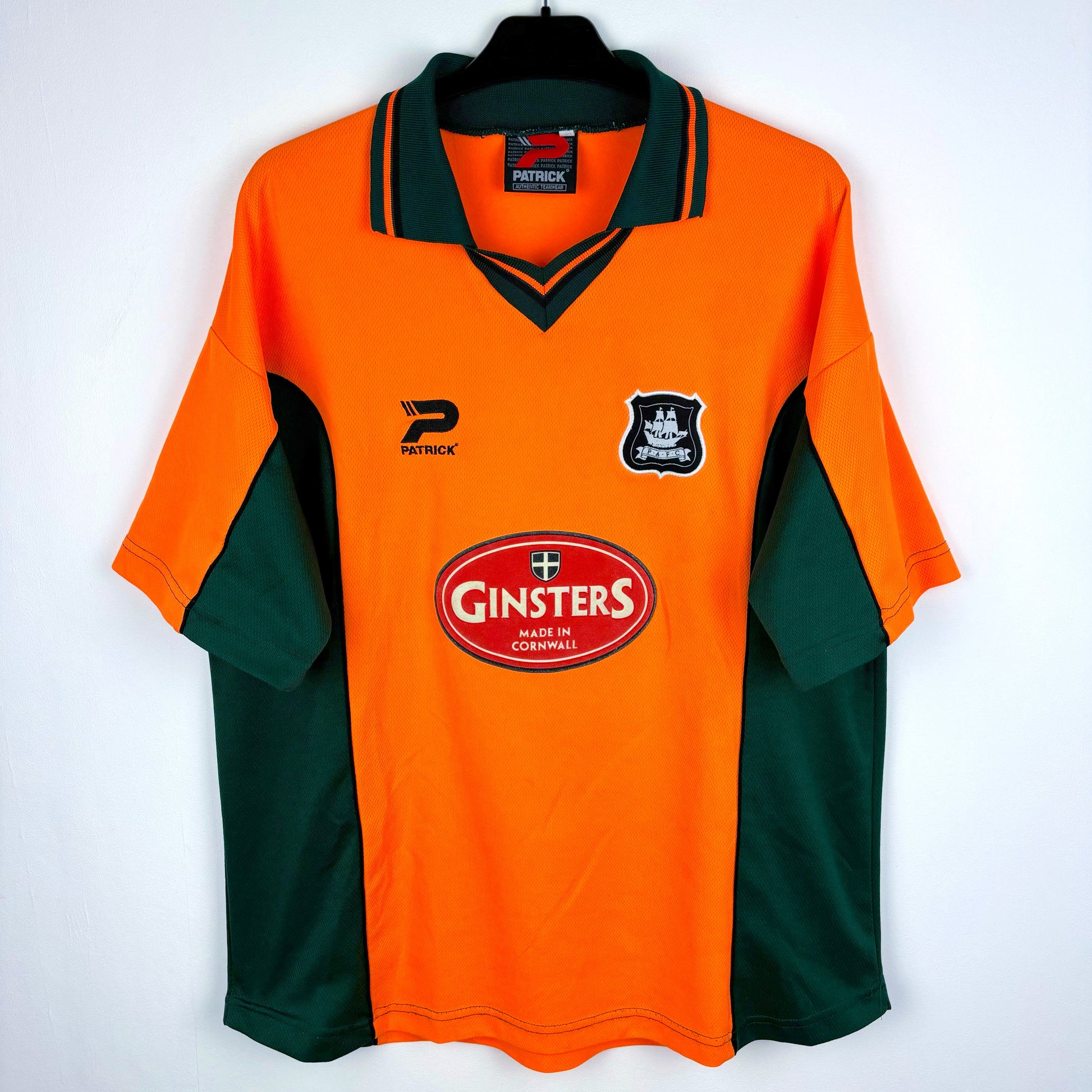 Plymouth Argyle 2002-2003 Patrick away vintage football shirt. Orange body with green trim. Ginsters sponsor.