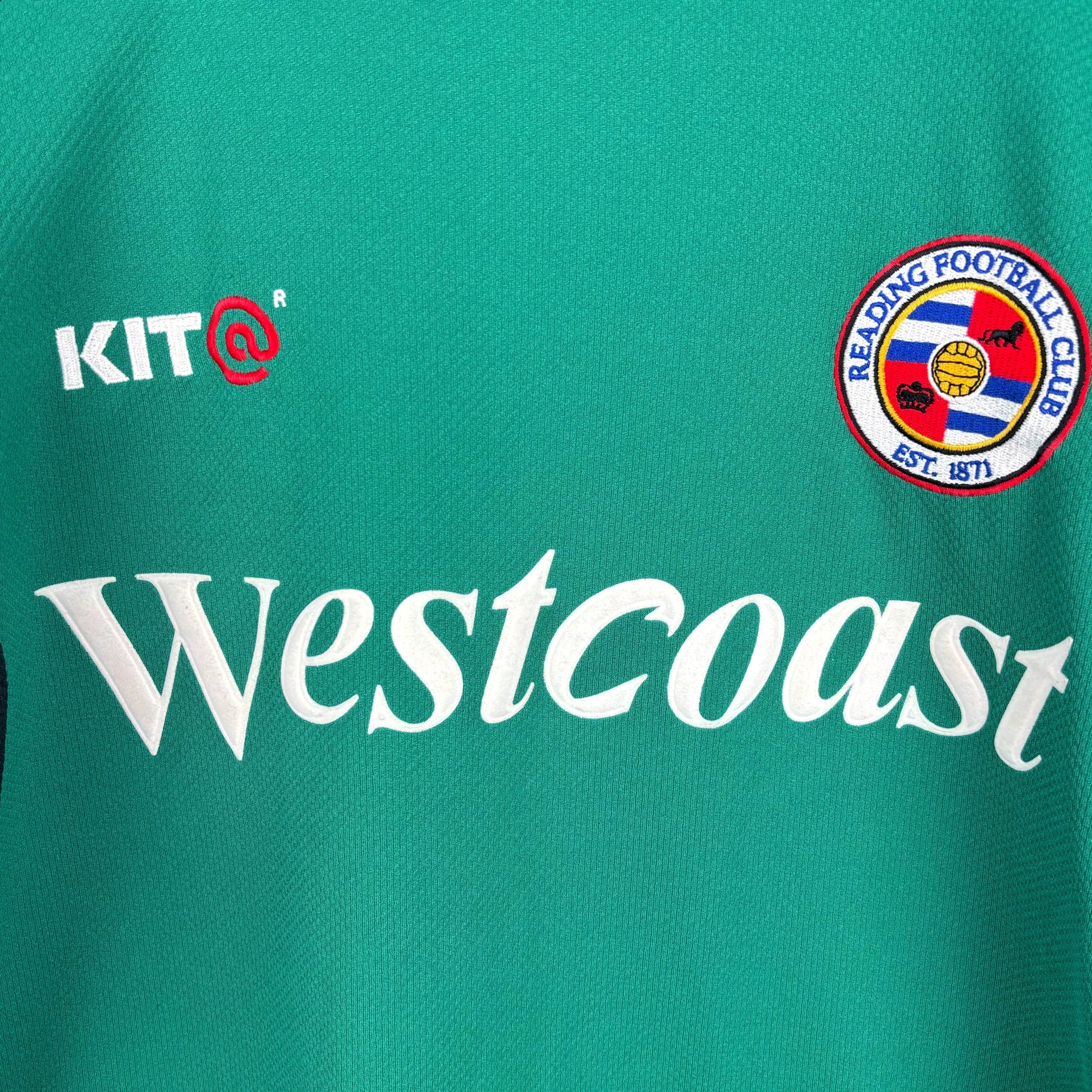 Close up central view of retro Reading FC 2001-2003 Goalkeeper Football Shirt. Embroidered Reading FC badge, Kit manufacturer and Westcoast sponsor