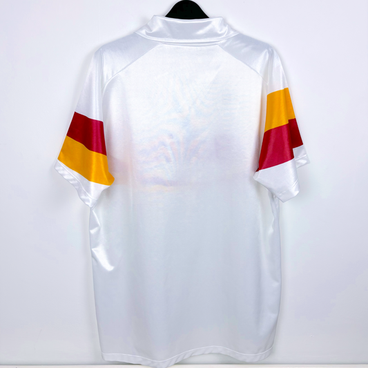 Rear view of Roma retro football kit produced by Ennerre. White body featuring orange and maroon swoosh across sleeves.