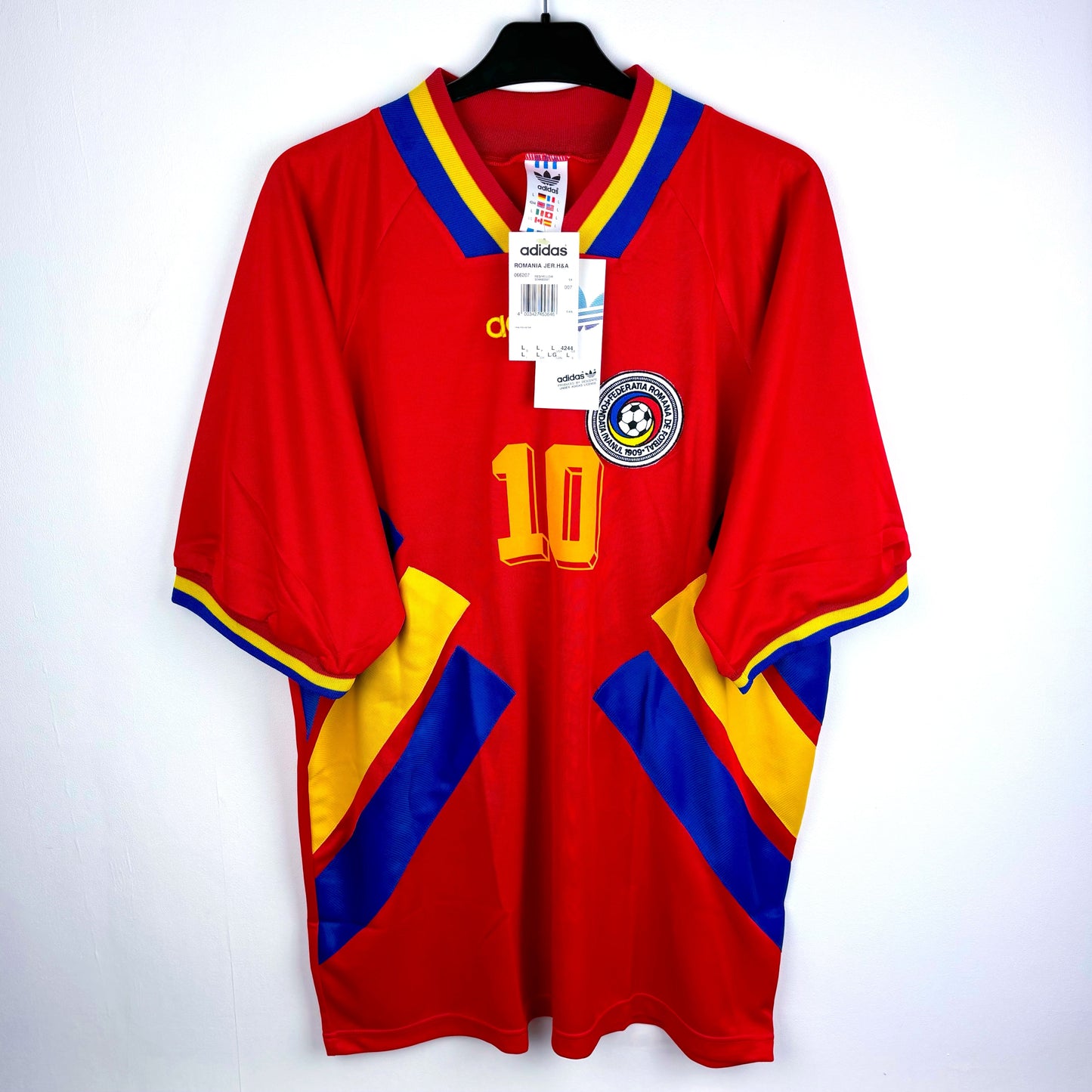 Romania 1994-1995 adidas away vintage football shirt. Red body with blue and yellow trim. Brand new with tags attached. 