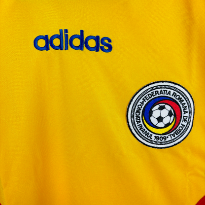 Romania 1994-1995 classic football shirt produced by Adidas. Close up of national team crest and adidas text embroidery.