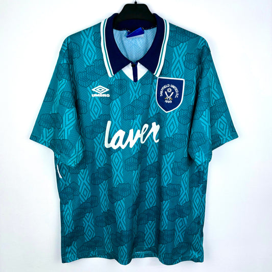 Sheffield United 1994-1995 away retro soccer jersey made by Umbro. Sublimated Umbro pattern in teal/emerald with navy collar